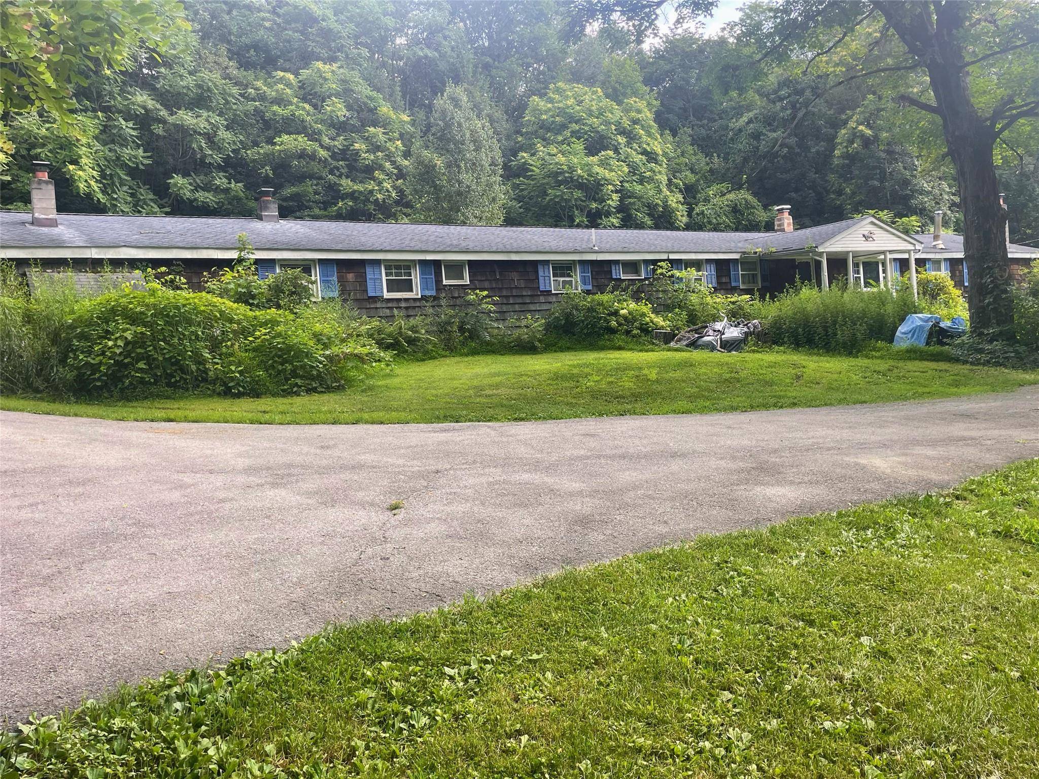 Endless Opportunities Await at This Unique 9 Acre Estate !