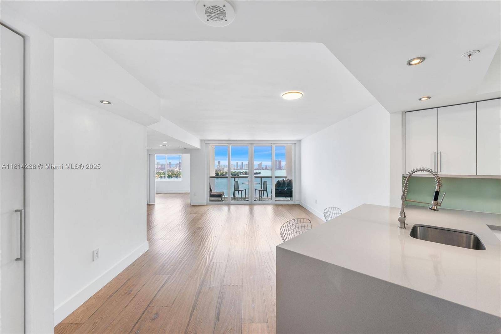 Fully renovated 2BR 2BA corner unit at Sunset Harbour North with direct bay skyline views from two private balconies.