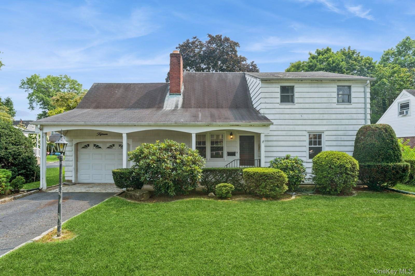 Lovely, 3 4 bedroom, 1. 5 bath expanded cape with a large eat in kitchen and a living room with a fireplace and dining space.