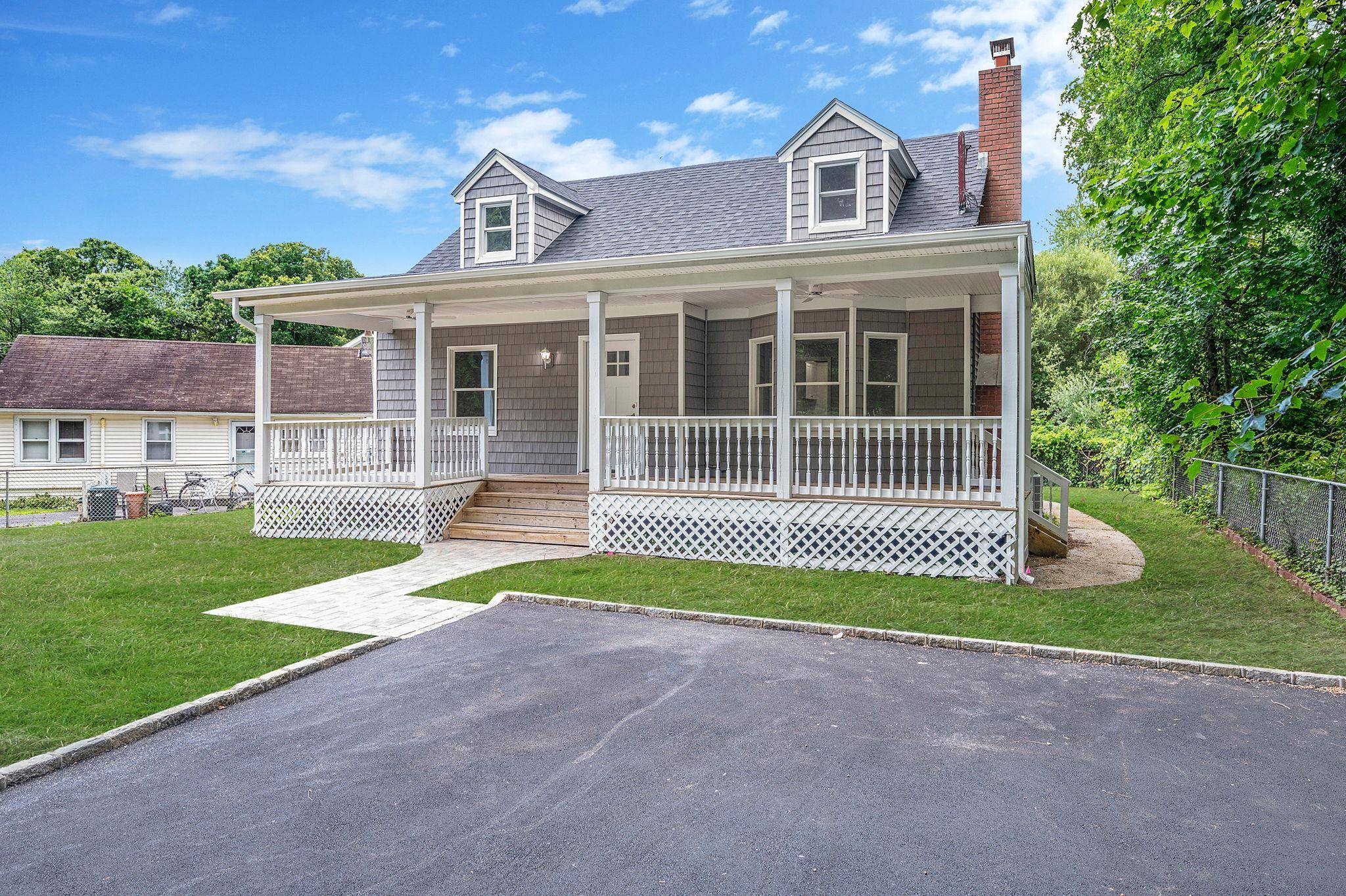 Beautiful turn key dormered Cape located in Smithtown township.