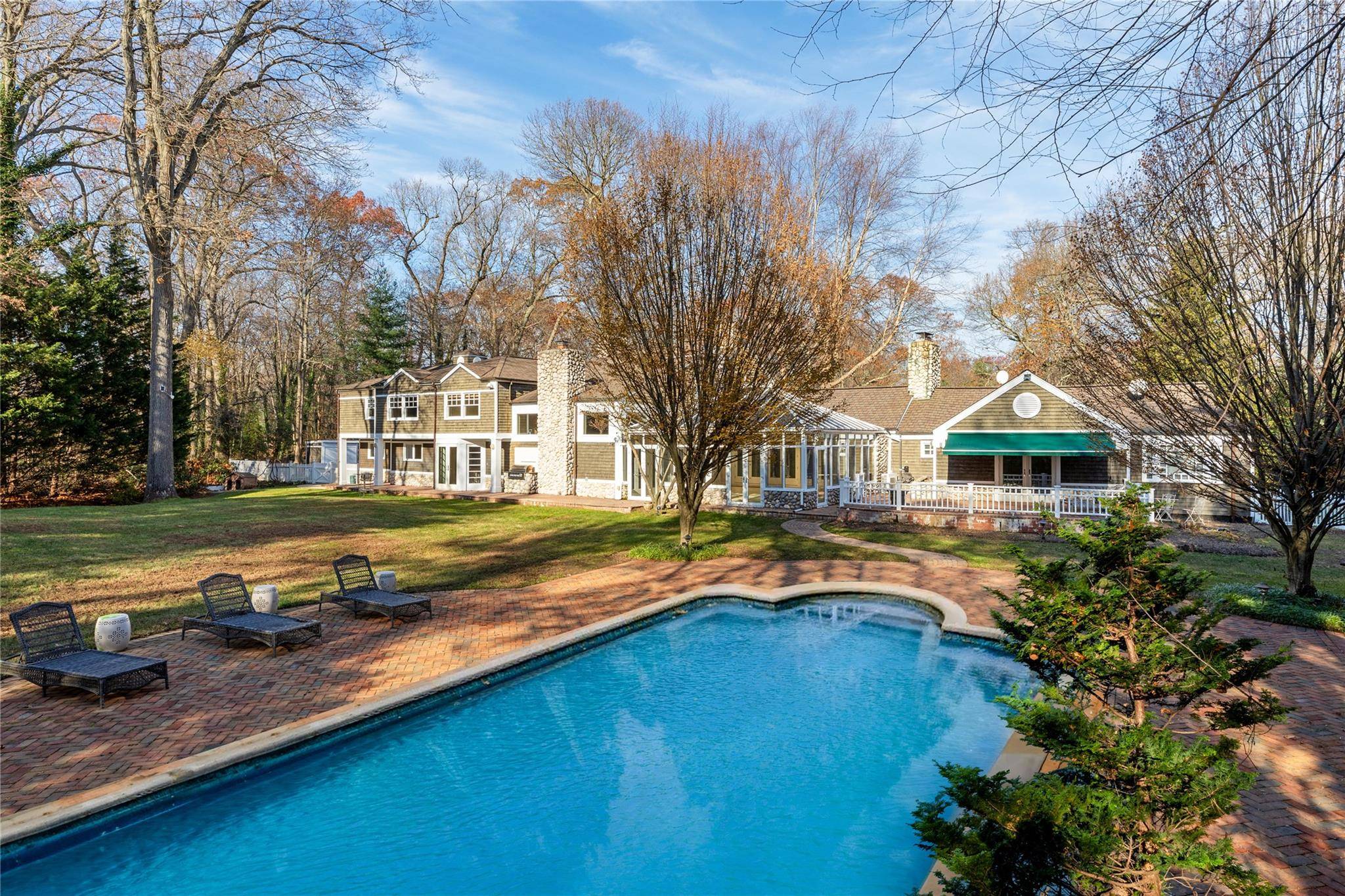 A beautiful shingled and stone farmhouse estate with elegant, updated high end finishes, located in the heart of the Village of Brookville, New York.