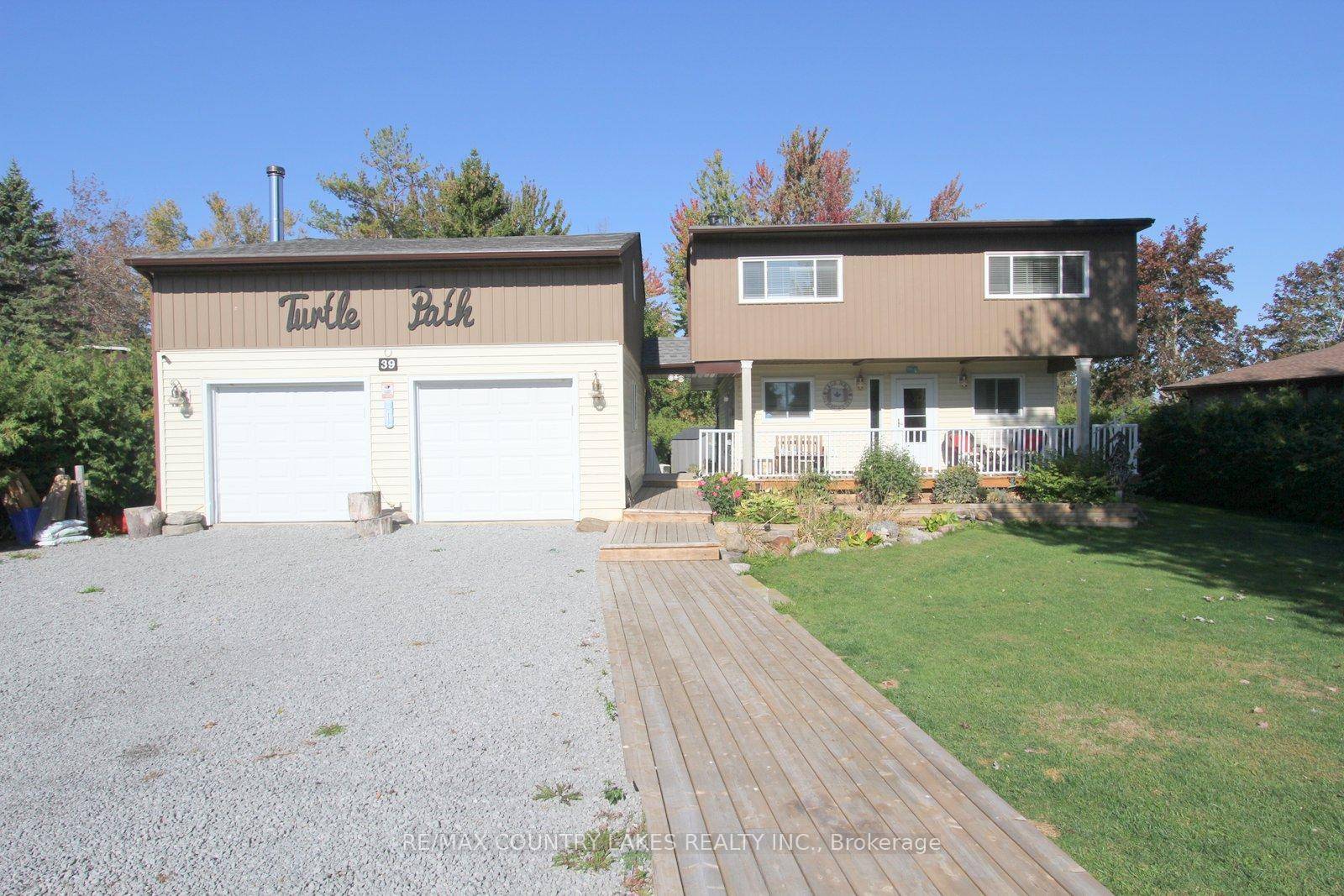 Charming 3 bdrm, 2 bath home perfectly situated on a picturesque pie shaped lot with 50 feet of canal frontage and direct boating access to Lake Simcoe.