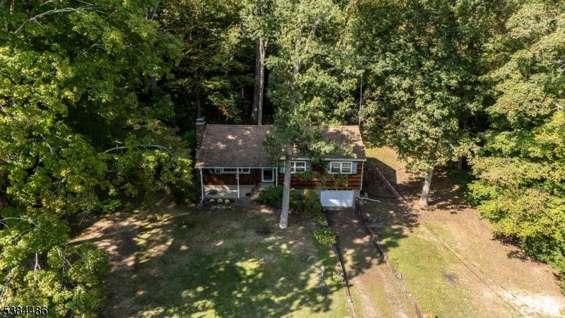 Country Charm is the best way to describe this lovely Oak Ridge home, set on nearly a half acre, backed by woodlands.