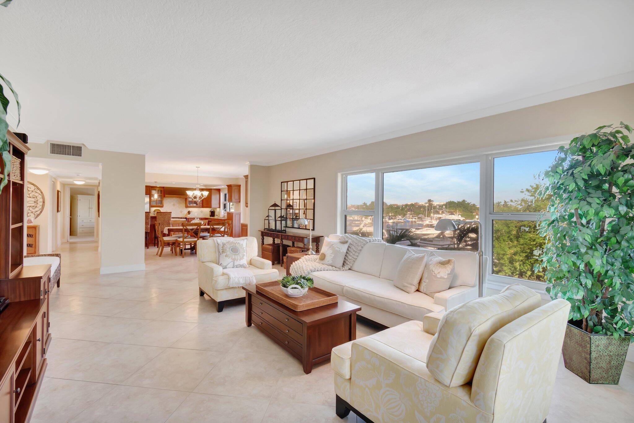Lovely and Spacious NE Corner Split BR Floor Plan with Intracoastal Views from the Living Room, Private Patio, Kitchen Dining area and Guest BR.