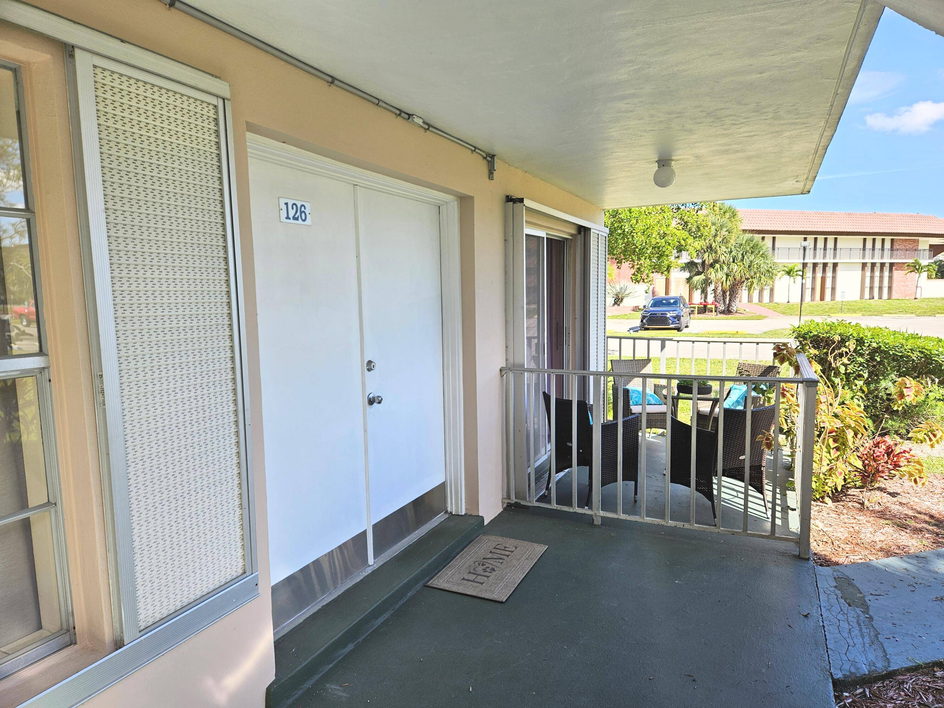 First Floor 2 2 well maintained corner unit condo with outdoor space and Florida room in the 55 active community of Lauderdale Oaks.