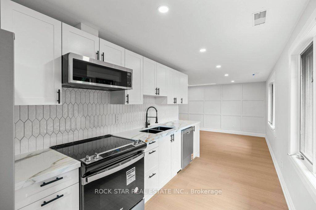 Welcome to this bright and spacious upper unit in a charming detached home !