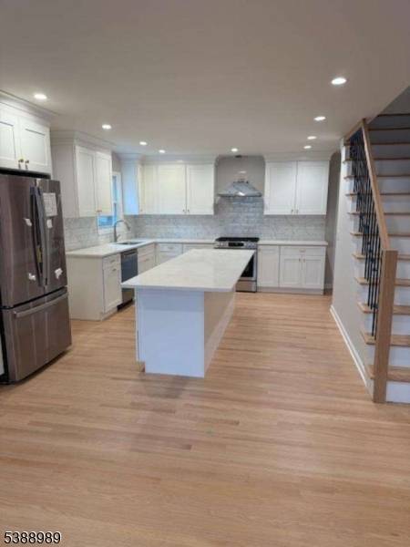 Welcome to this stunning four bedroom, two bath home, thoughtfully renovated from top to bottom with todays modern lifestyle in mind.
