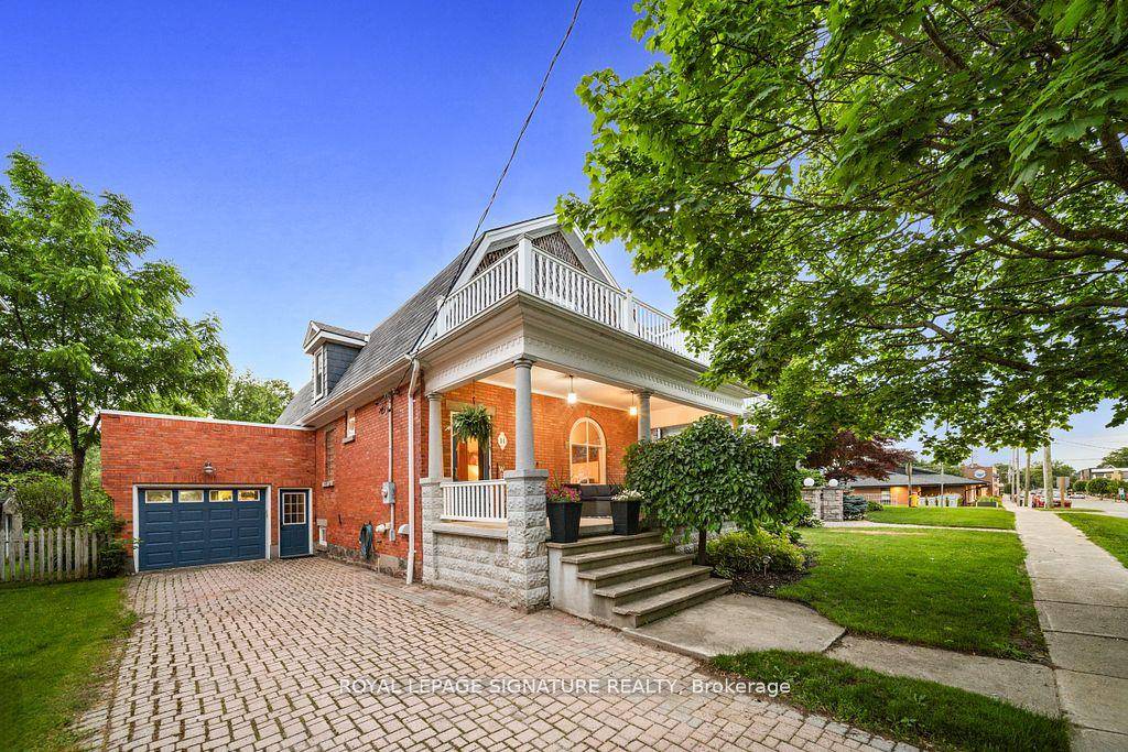 Experience the perfect blend of timeless elegance and refined rural living in this exquisite Barndominium style red brick century home, a true architectural gem dating back to 1910.