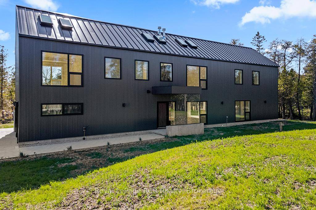 This MODERN LONGHOUSE, designed by a Dubai based architect, is truly unique for the Bruce Peninsula.