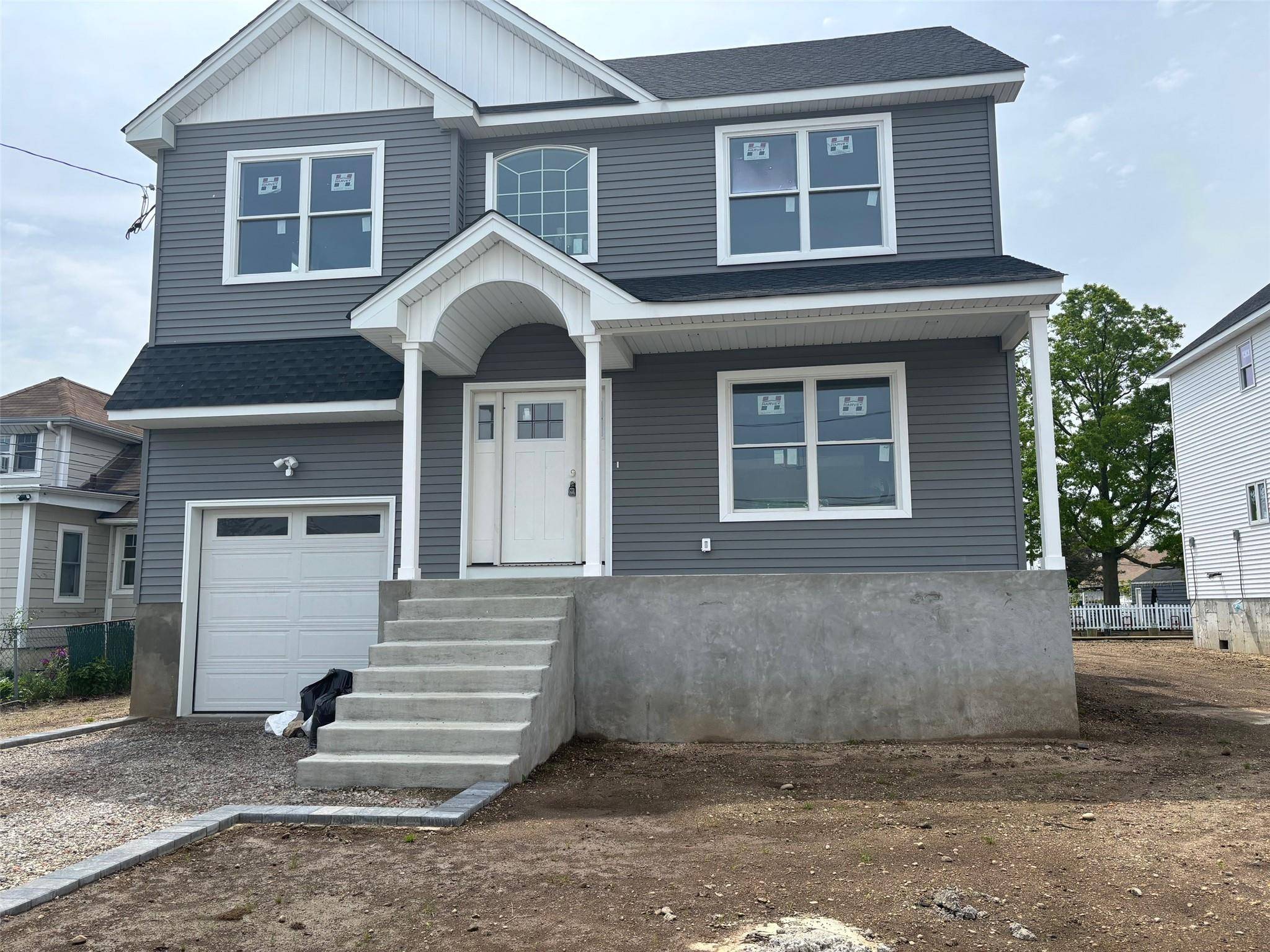 A newly constructed colonial waterfront residence is available in Baldwin Harbor.