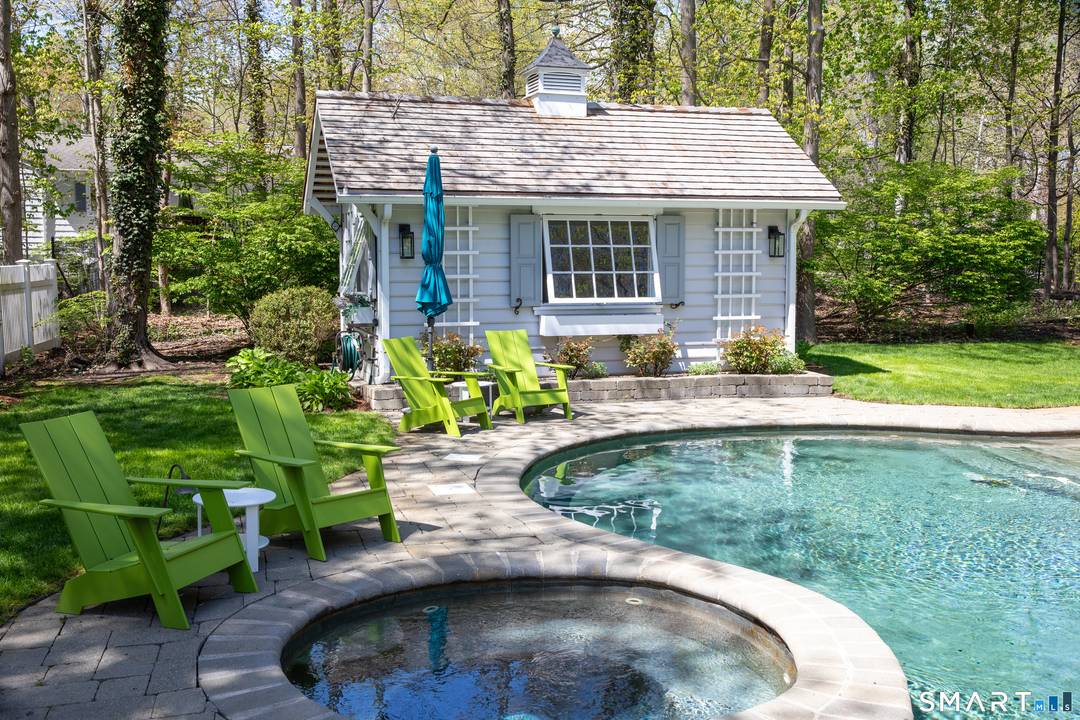 Tucked away on a peaceful one acre property, this charming summer retreat offers privacy and comfort in a serene setting.