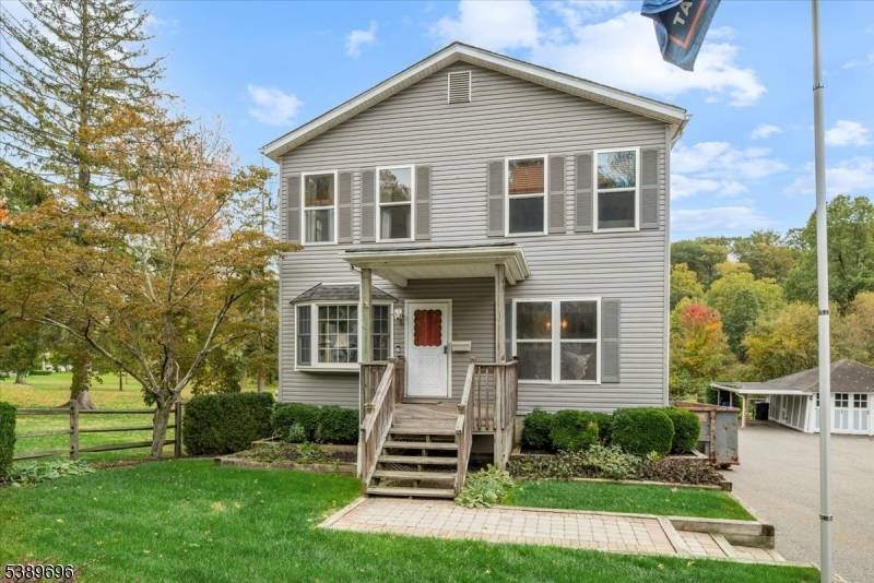 Custom, modular home backing to the fountain at Burnham Park offers formal living room, dining room, familiy room, kitchen, powder room and separate enclosed porch on the first floor, 4 ...