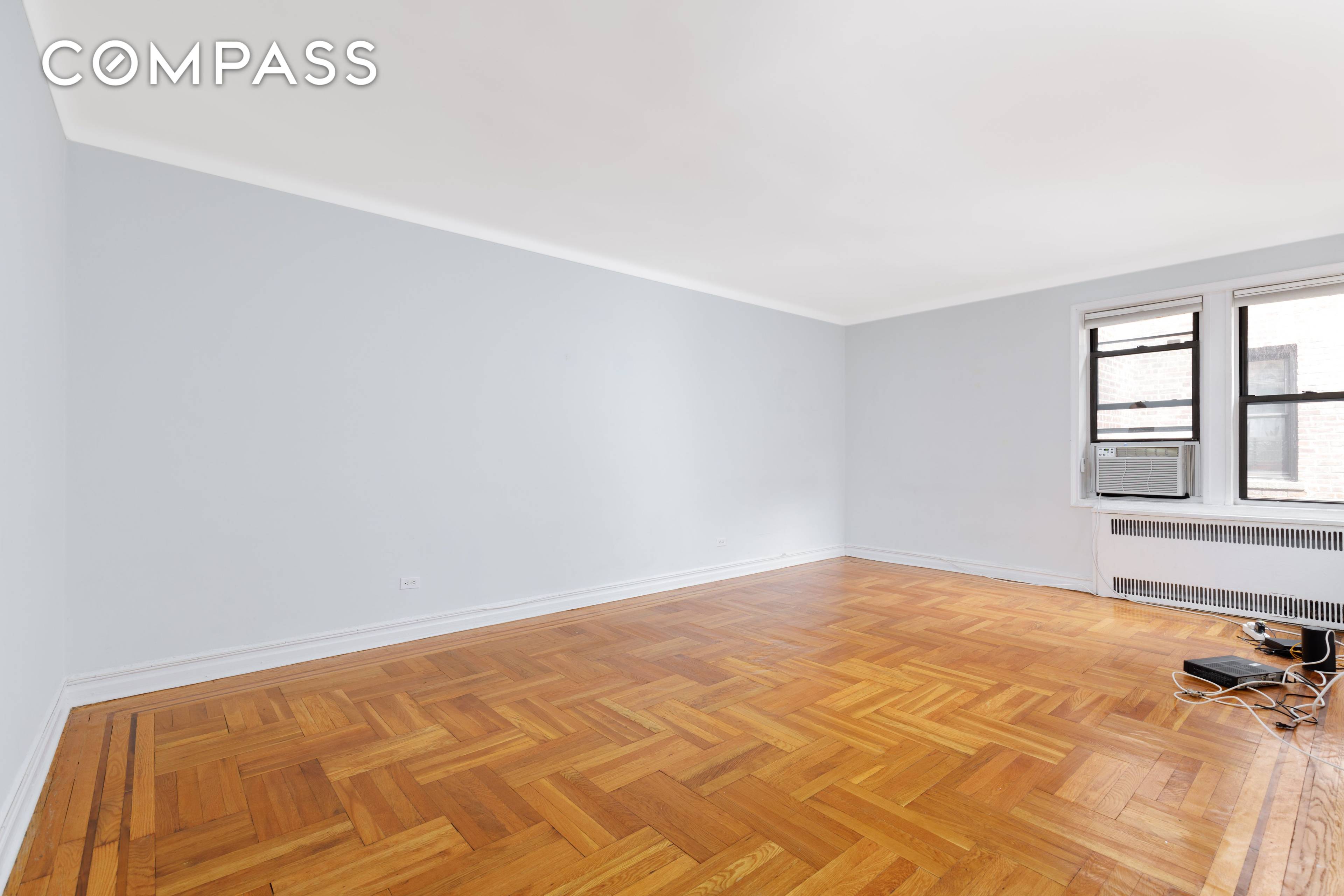 Showing By Appointment Only 221 East 18th Street Unit 5F is a well thought out 5th floor apartment that offers a functional layout, an abundance of sunlight, and unique pre ...