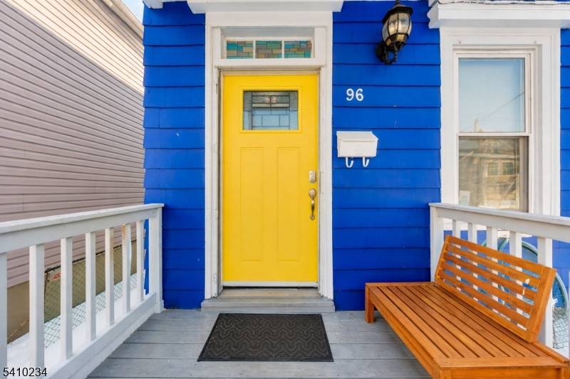 Charming Colonial featuring a living room with decorative fireplace and built ins, formal dining room, and adjoining work kitchen.