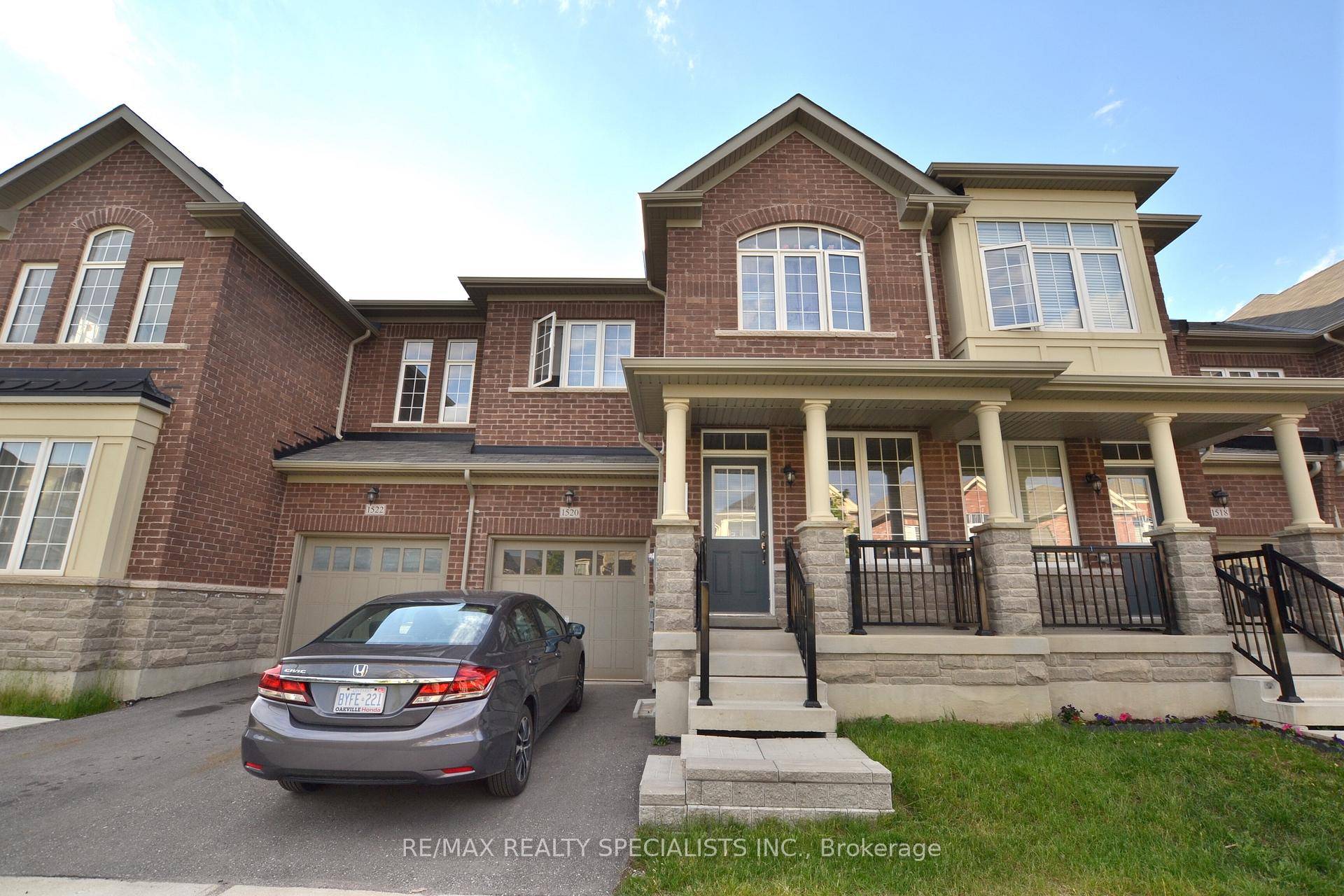 Step into luxury with this stunning stone and brick townhouse, crafted by the prestigious Tiffany Park Homes.