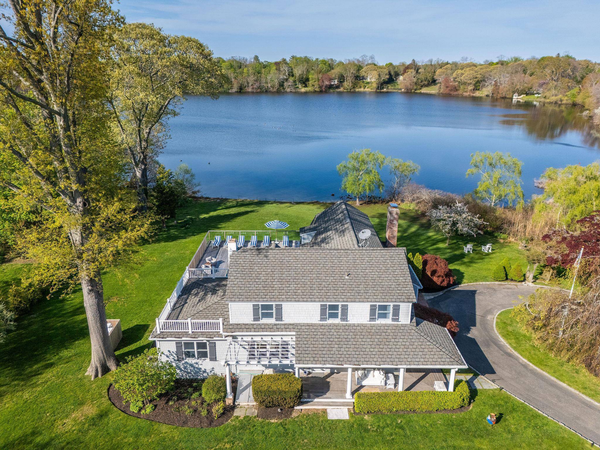 Serene Lake Front Estate in Mattituck Situated on over an acre of tranquil waterfront, this peaceful and private estate offers stunning views of Maratooka Lake and a lifestyle of luxury ...
