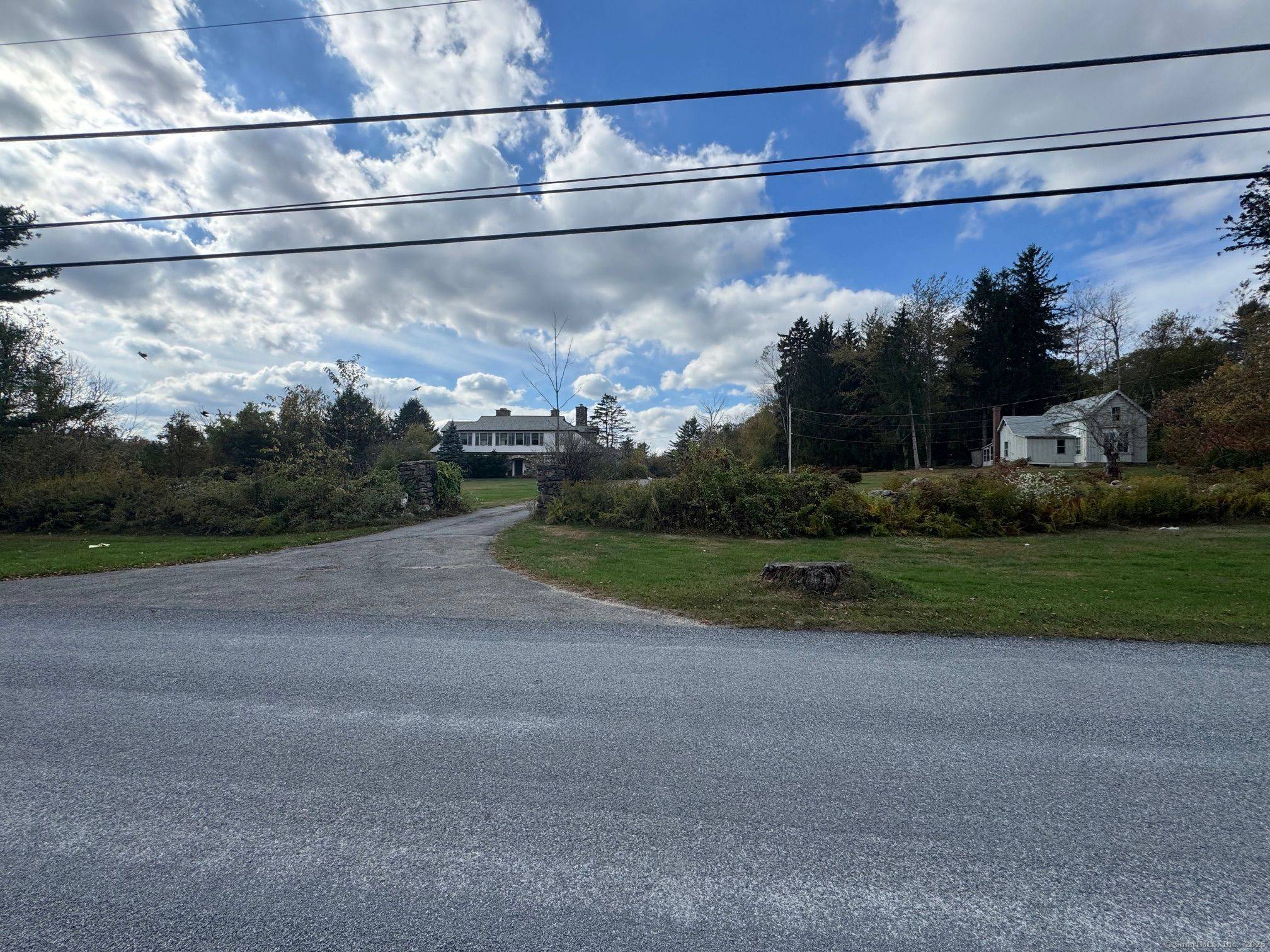 Distinctive Country Estate with Two Homes on 9.