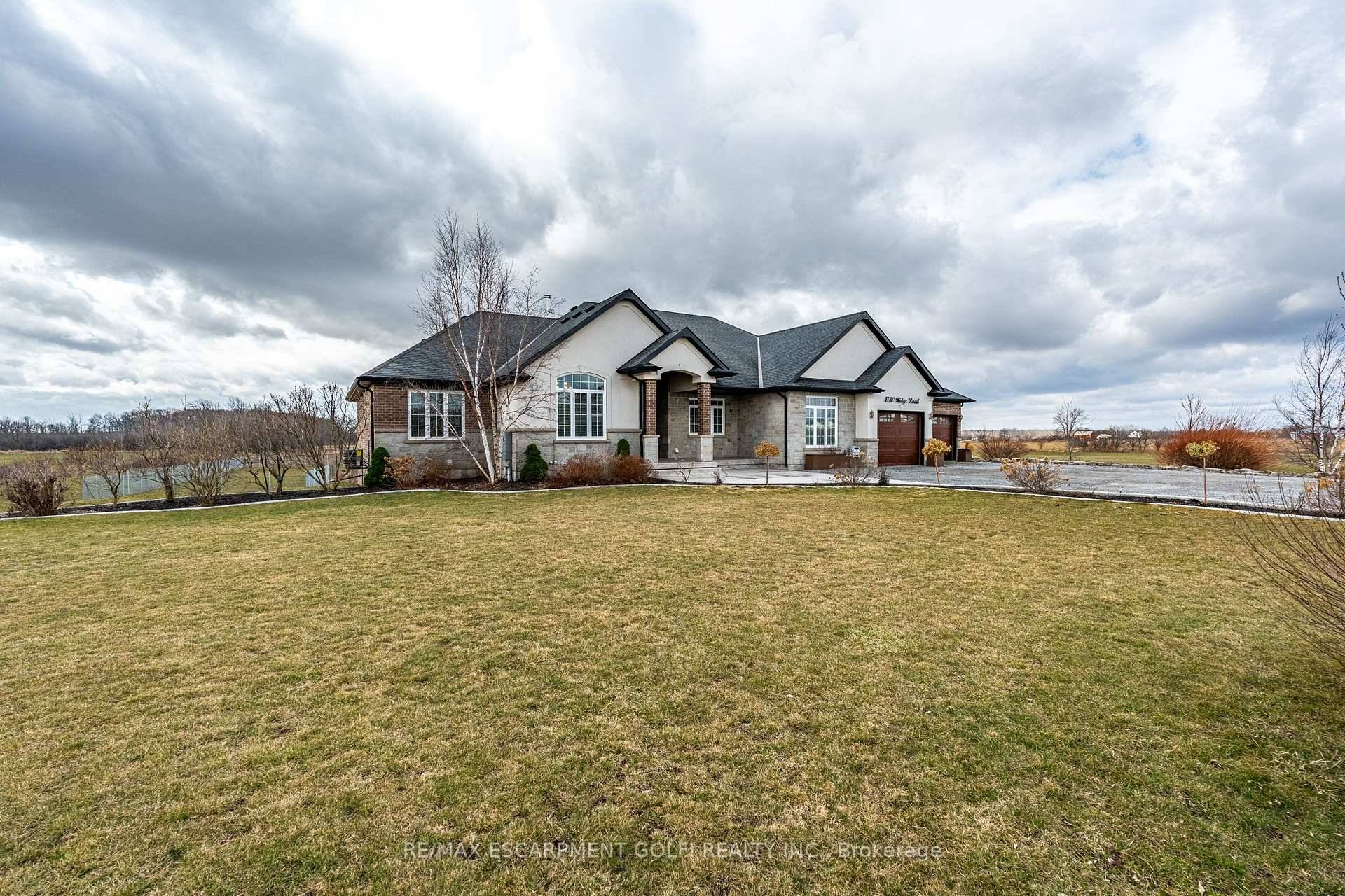 Custom Bungalow on 21. 14 Acres with Workshop, Pond amp ; Luxury Finishes.