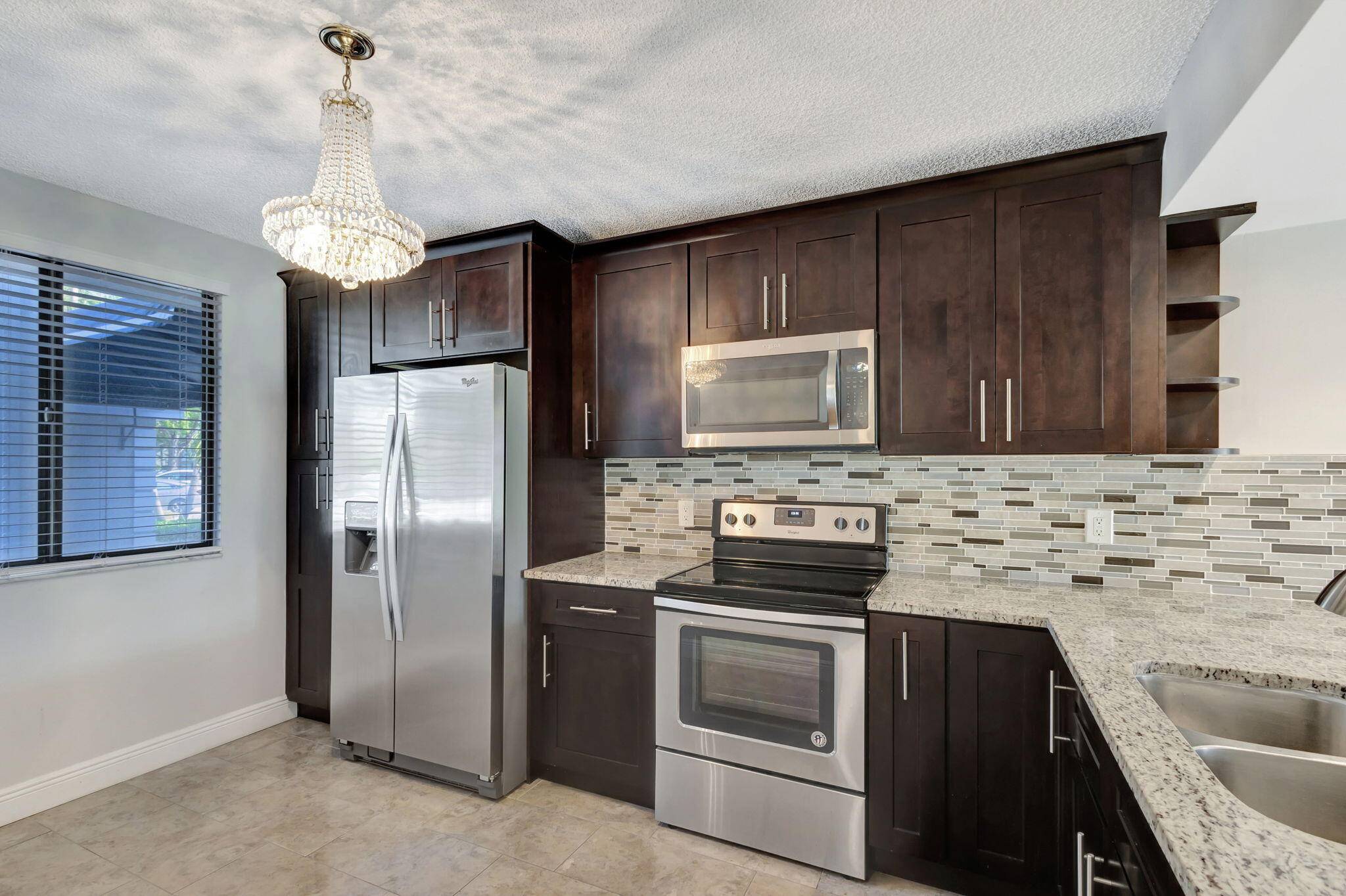 Centrally located 2 2 with bonus room in the heart of Palm Beach County.