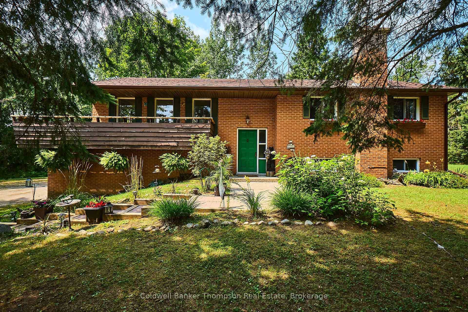 Solid brick split level home resting on a 2 acre lot in the village of Novar.