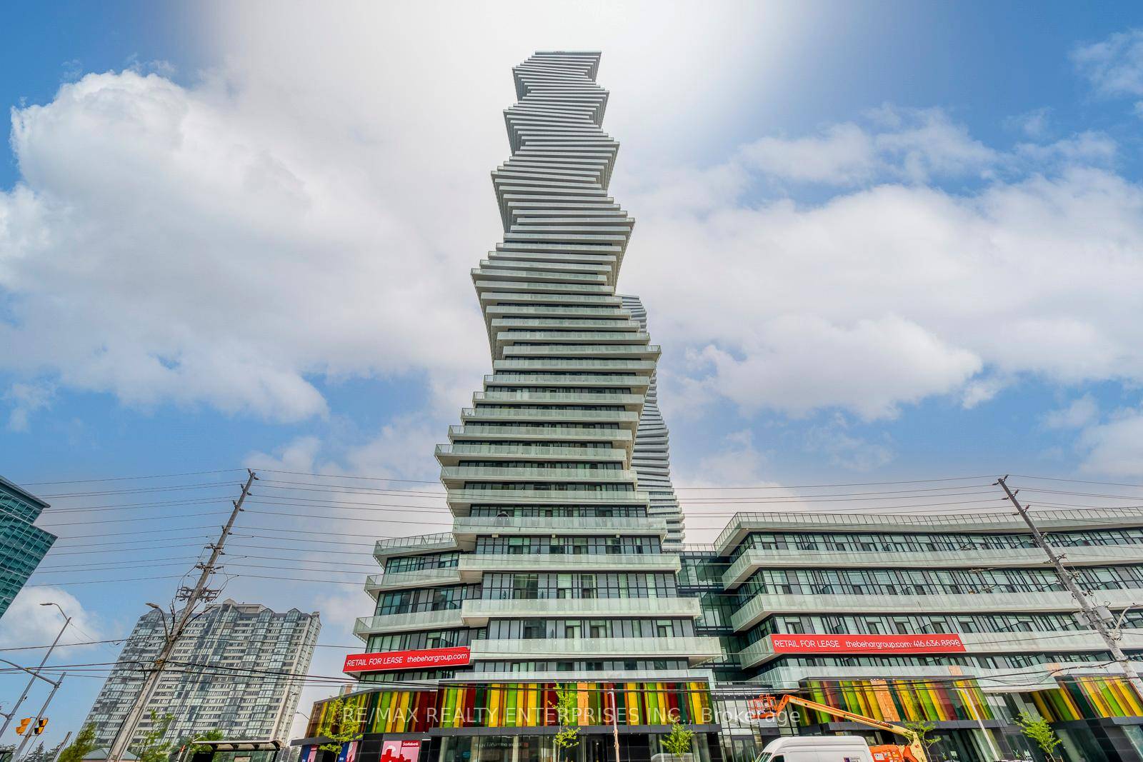 Spacious and sun filled 2 bedrooms, 2 full bathrooms east facing corner unit with floor to ceiling windows and a large wraparound balcony access from both bedrooms and living room.