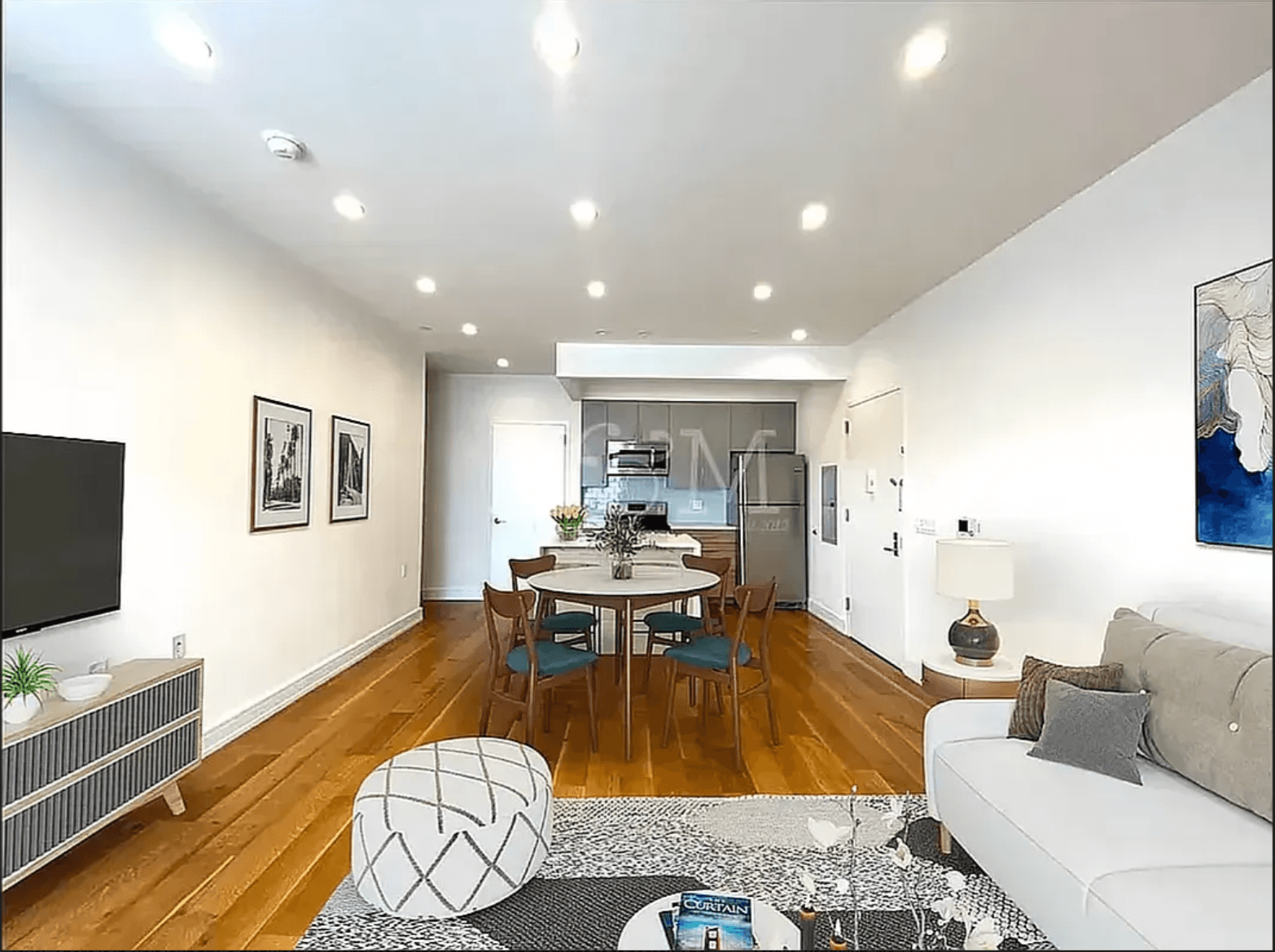 THE UNIT This spacious first floor duplex features an open layout and two full bathrooms on each level.