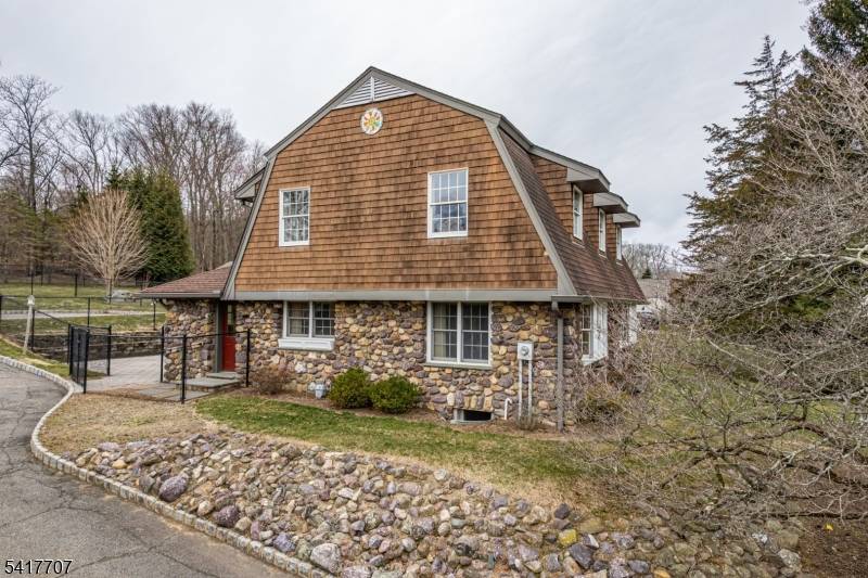 Beautiful Fieldstone Colonial overlooking the Rockaway River !
