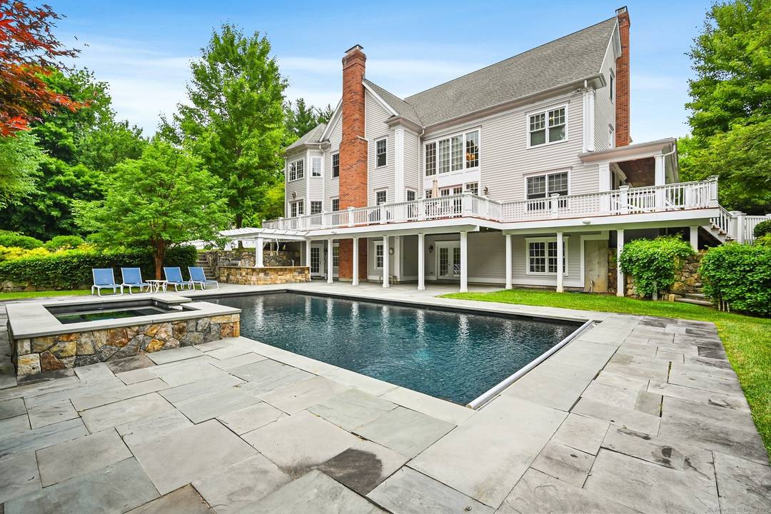 Welcome to your grand private estate set on a South Wilton cul de sac.