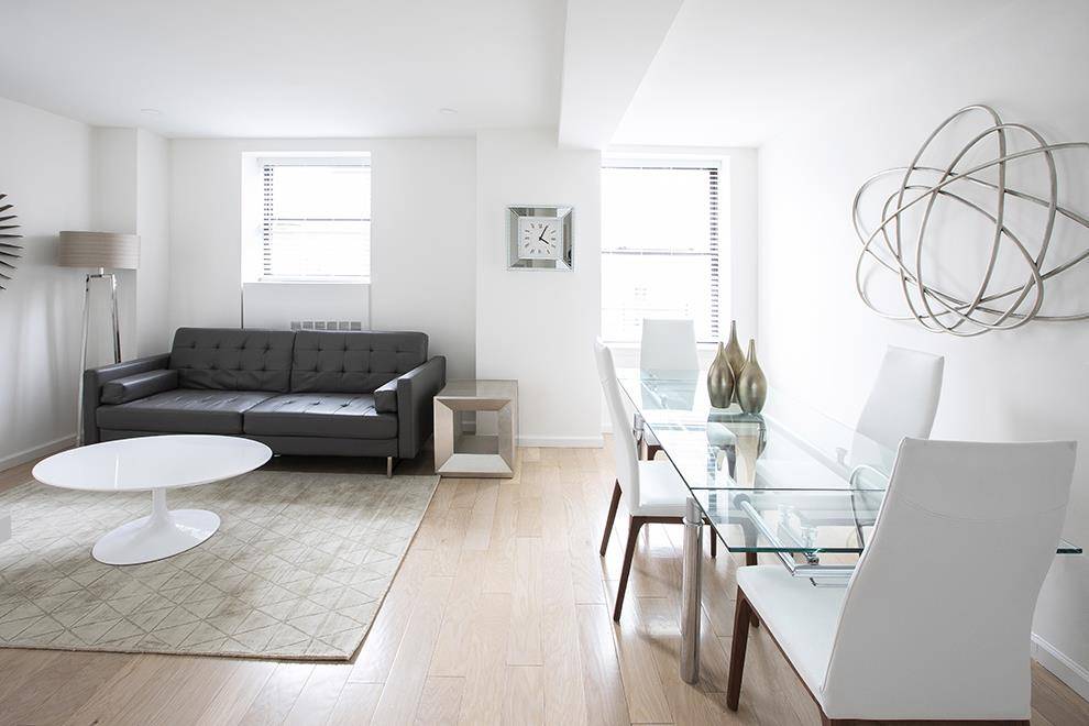 Welcome to this bright and thoughtfully designed fully furnished one bedroom, one bathroom residence perfect as a primary home, pied a terre, or investment opportunity.