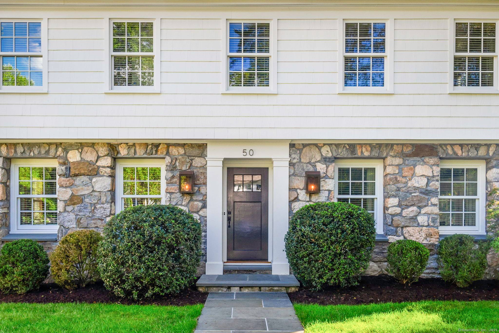 Originally built in 1929, this distinguished residence has been meticulously expanded and renovated to showcase time honored design reimagined for contemporary living.