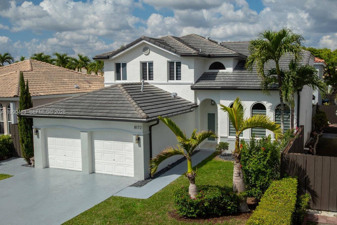 SHOWCASE HOME in the coveted guard gated community of Poinciana at Sunset Lakes Estates.