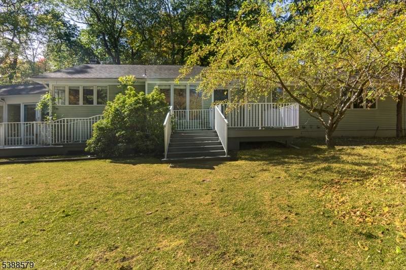Welcome to easy living in this beautifully designed ranch style home, nestled on 1.