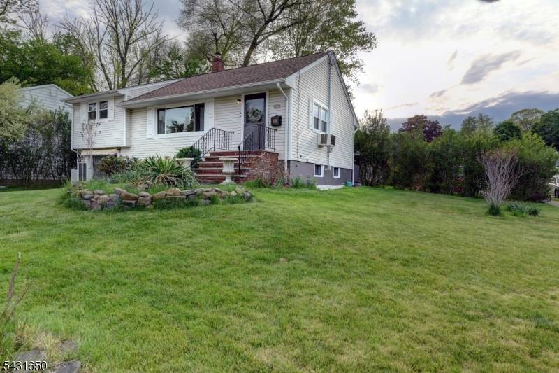 Nicely maintained mid century back split on a prime corner lot in the heart of Cedar Grove's recreation corridor.