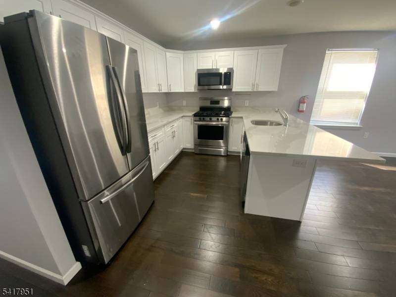 Home build 2023 like new 1st Fl garage, utility room, rec room, w half bath connection to apartment 1 with3 bedrooms living room, dining room, kitchen and 2 full baths ...