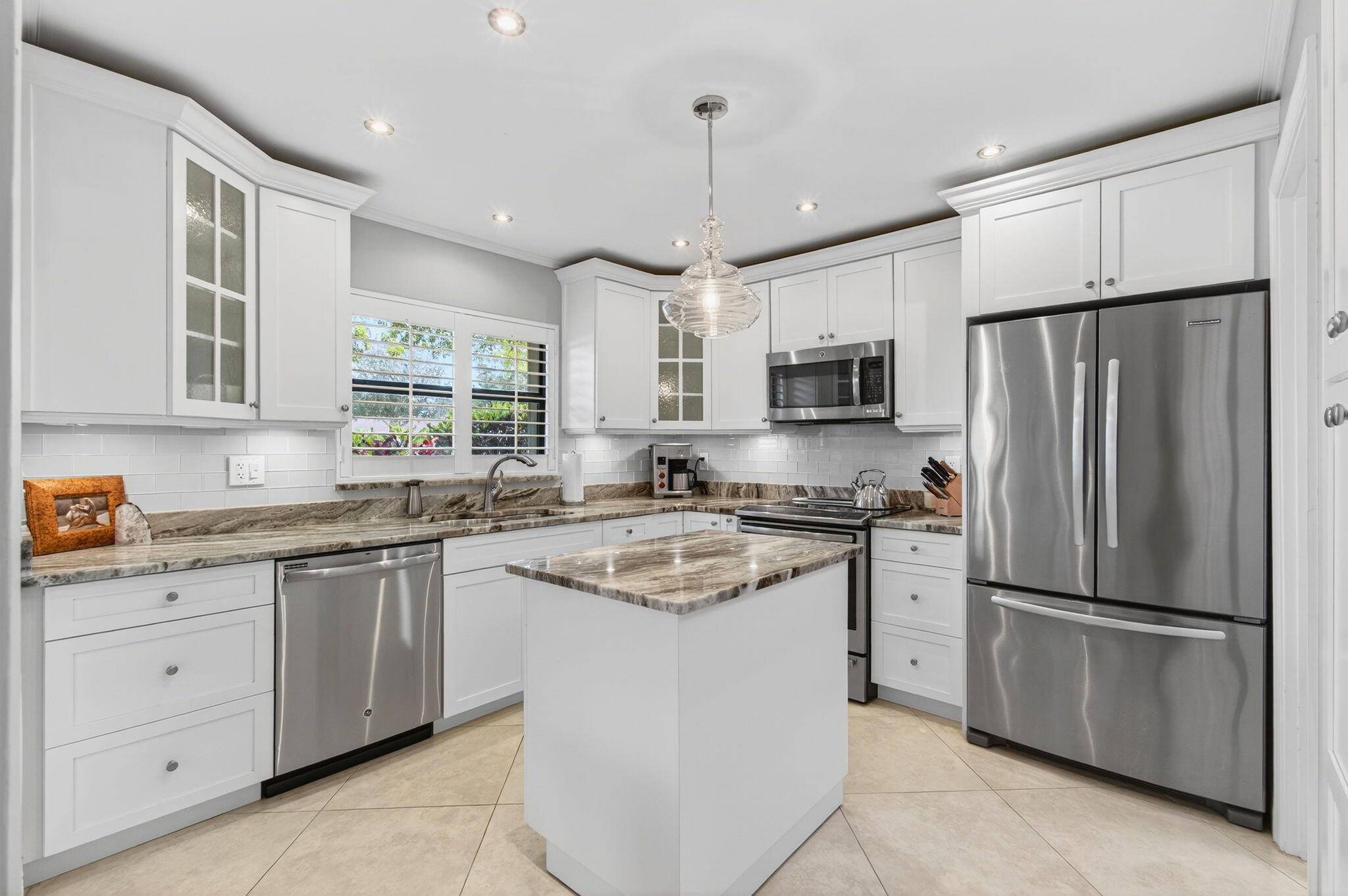 Pride of ownership is evident from the moment you step into this completely renovated 2BR 2BA 1 car garage villa.