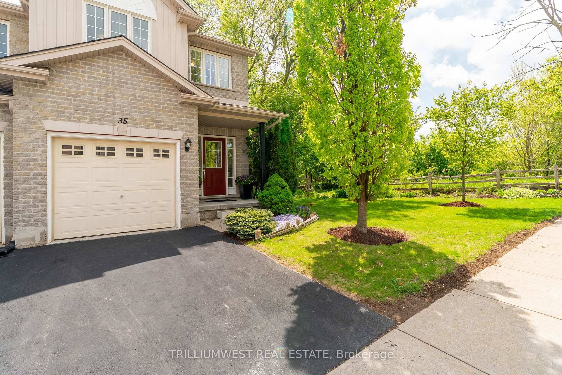 Welcome to this beautifully maintained end unit townhouse, ideally positioned for maximum natural light and privacy.