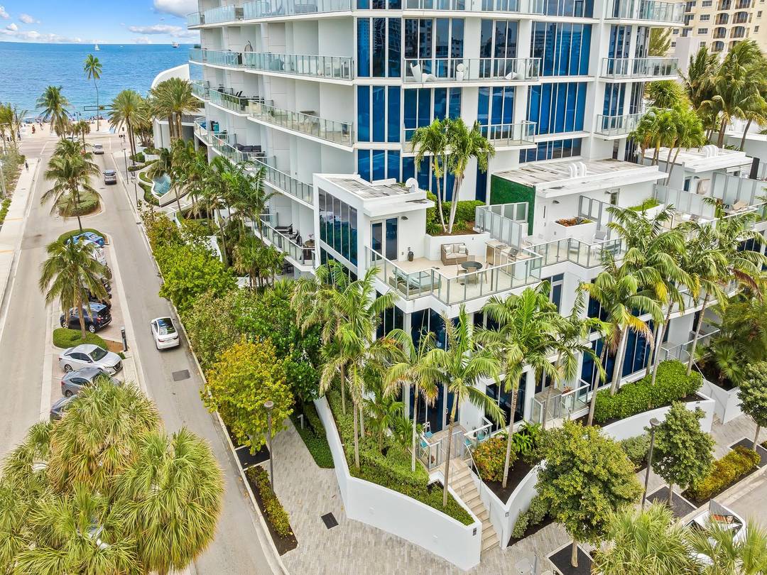 Rarely available corner townhome at Paramount Residences with ocean views offering two entrances including a grand lobby entrance and a private outdoor lanai entrance.