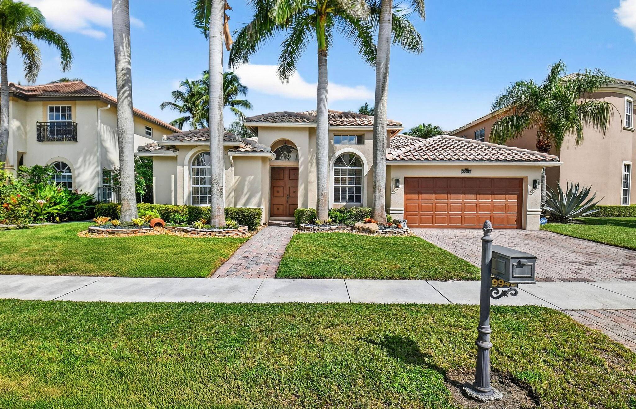 This stunning 4 bedroom residence showcases sweeping lake views, soaring coffered ceilings, plantation shutters, and timeless architectural details.