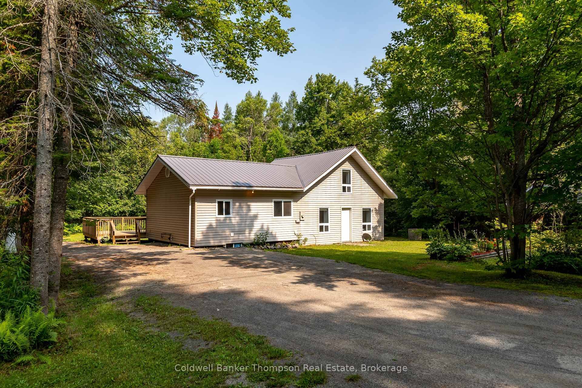 Set on just over half an acre of level, open land, this well cared for 1.