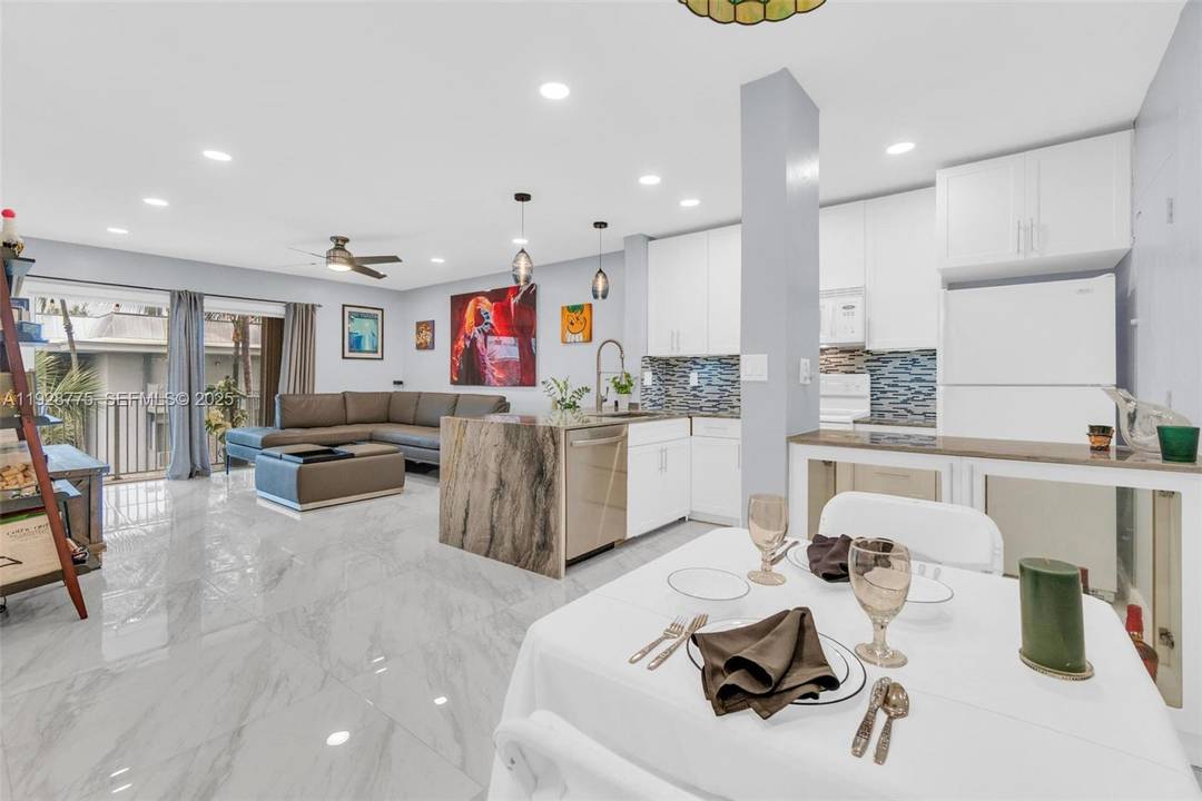Contemporary 2023 updating includes 24x24 porcelain floors amp ; paint job thru out entire unit, new waterfall granite kitchen counters, new extra large sink amp ; faucet, new white kitchen ...