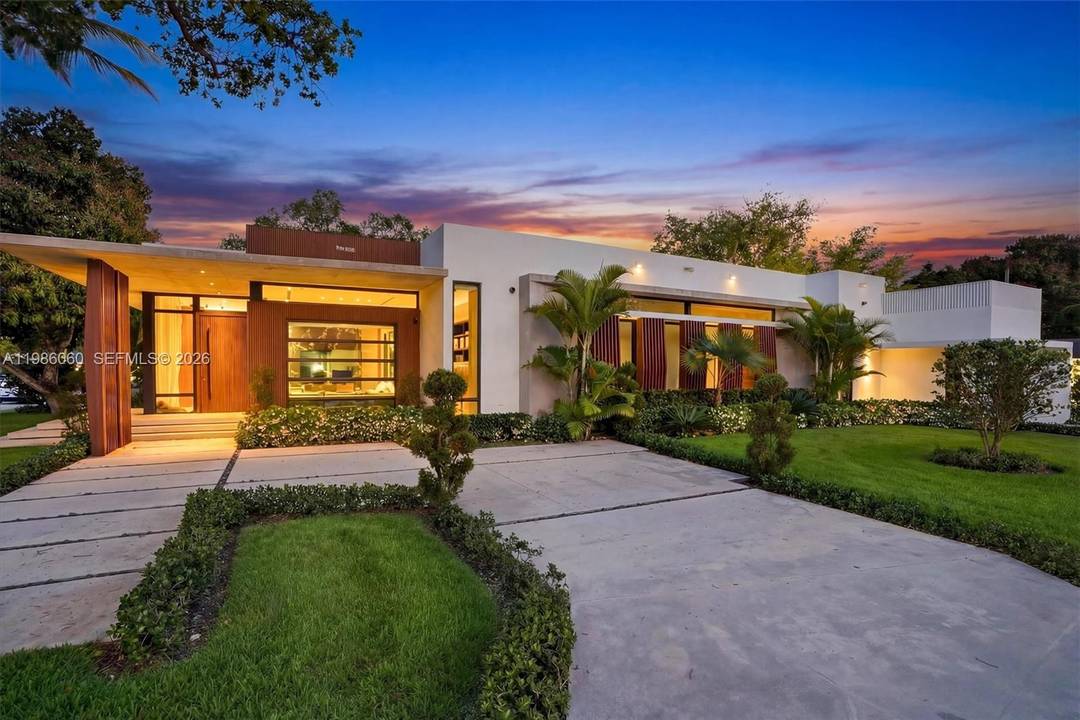 Villa Serene is a show stopping corner lot estate where modern luxury meets coastal elegance, just steps from Biscayne Bay.