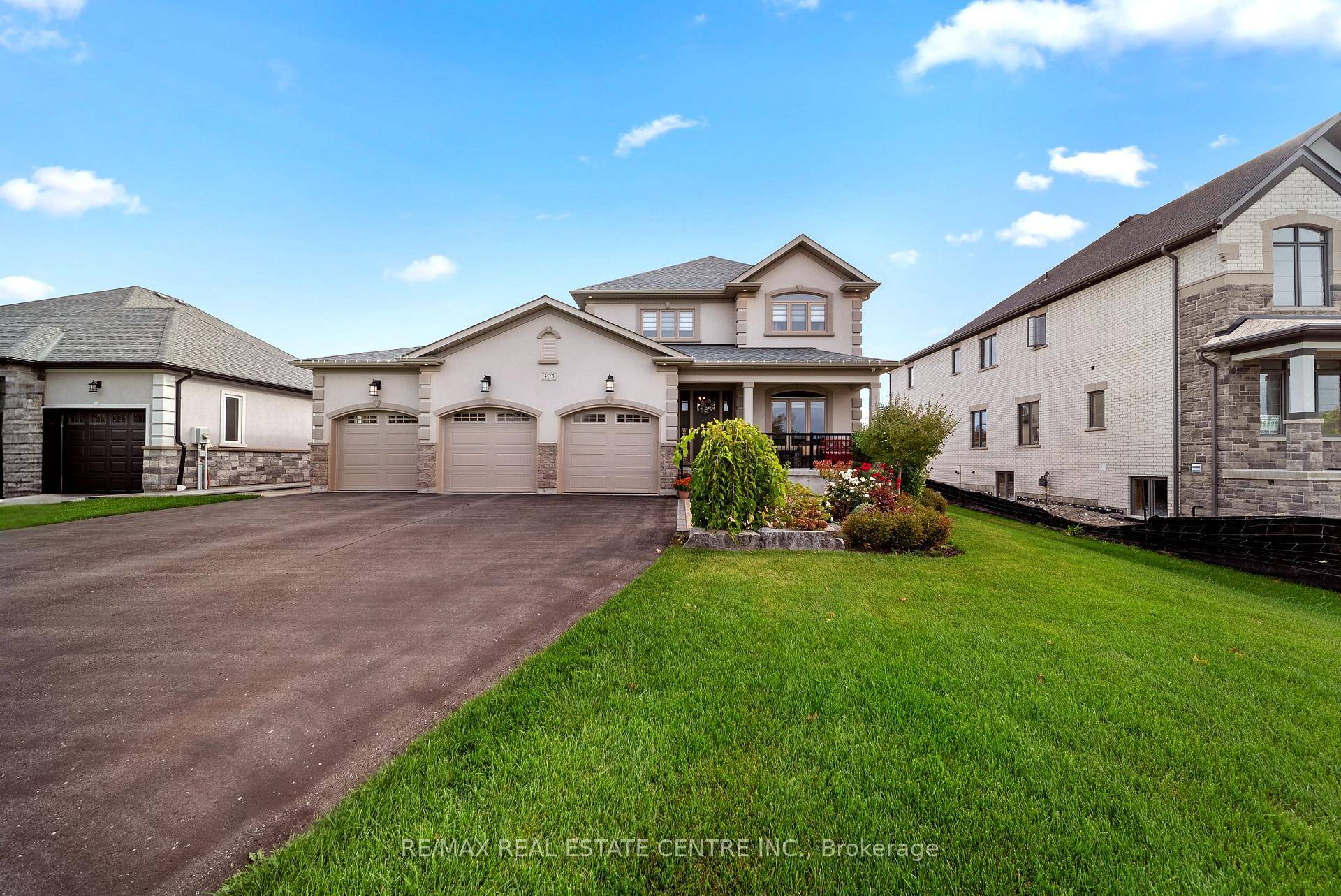 Welcome to 303 Sunnybrae Avenue, a truly one of a kind custom home in prestigious Innisfil Estates.