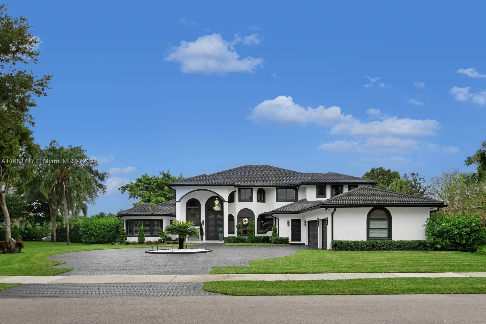 In Davie, this sprawling 7 bedroom, 4.
