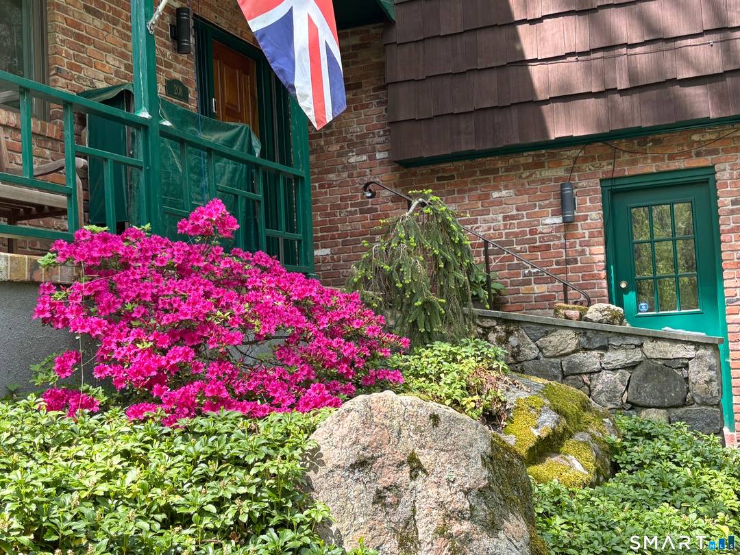 Private tucked away on the Stamford New Canaan border, you'll find this enchanting contemporary home perfectly blended with its rich natural landscape.