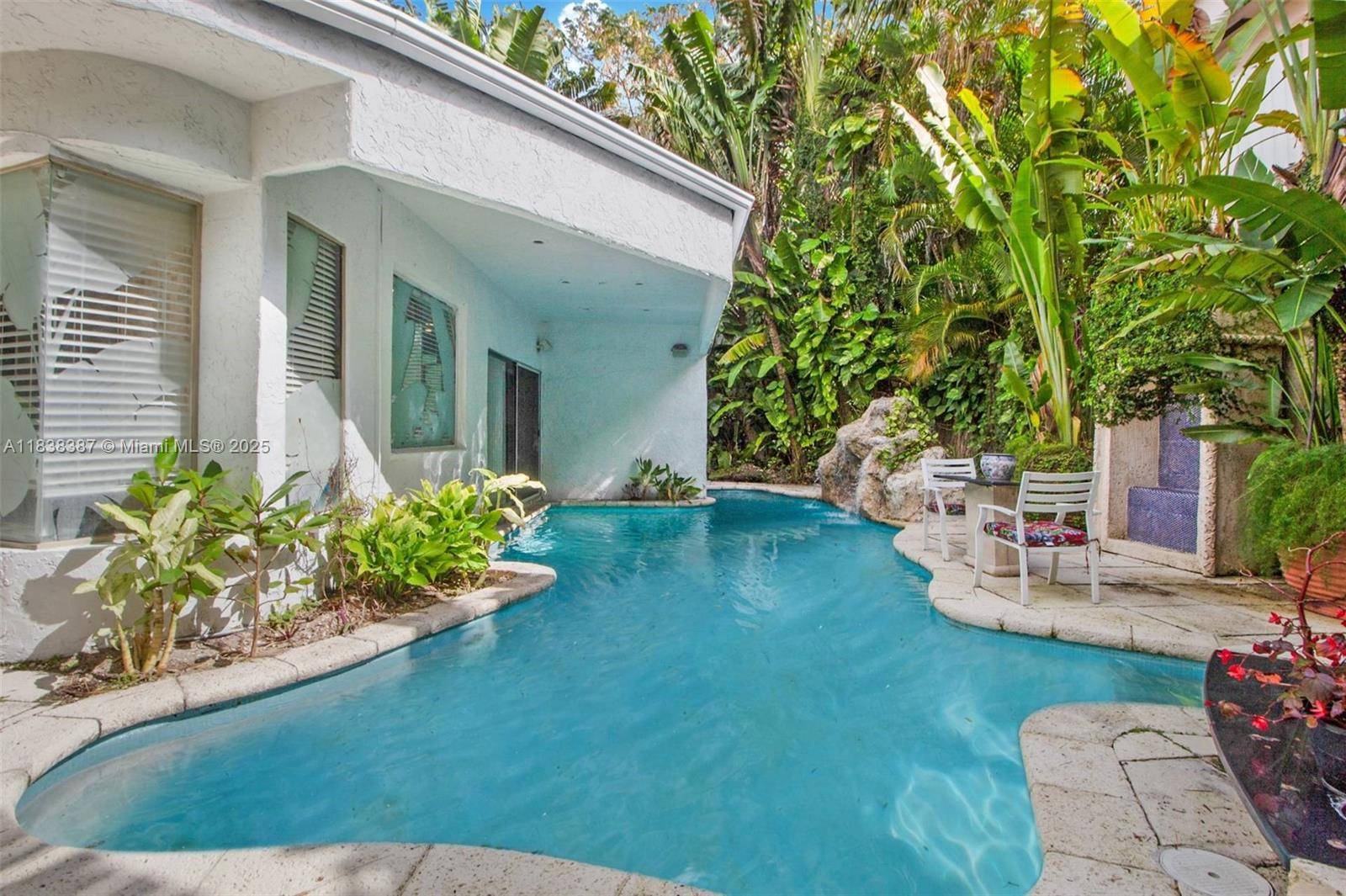 Tropical tranquility meets vintage contemporary charm on coveted Morris Lane in Coconut Grove !