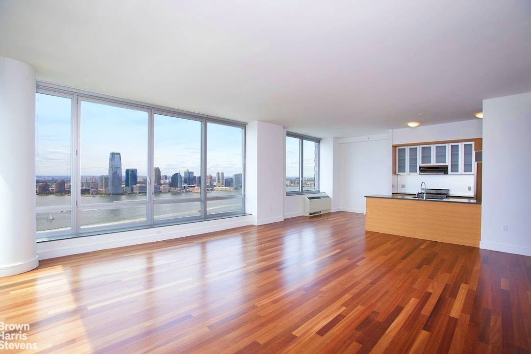 VIEWS, VIEWS, VIEWS ! Enjoy absolutely spectacular, panoramic views of the Hudson River and Statue of Liberty from this sprawling 2, 100 square foot apartment with floor to ceiling windows ...