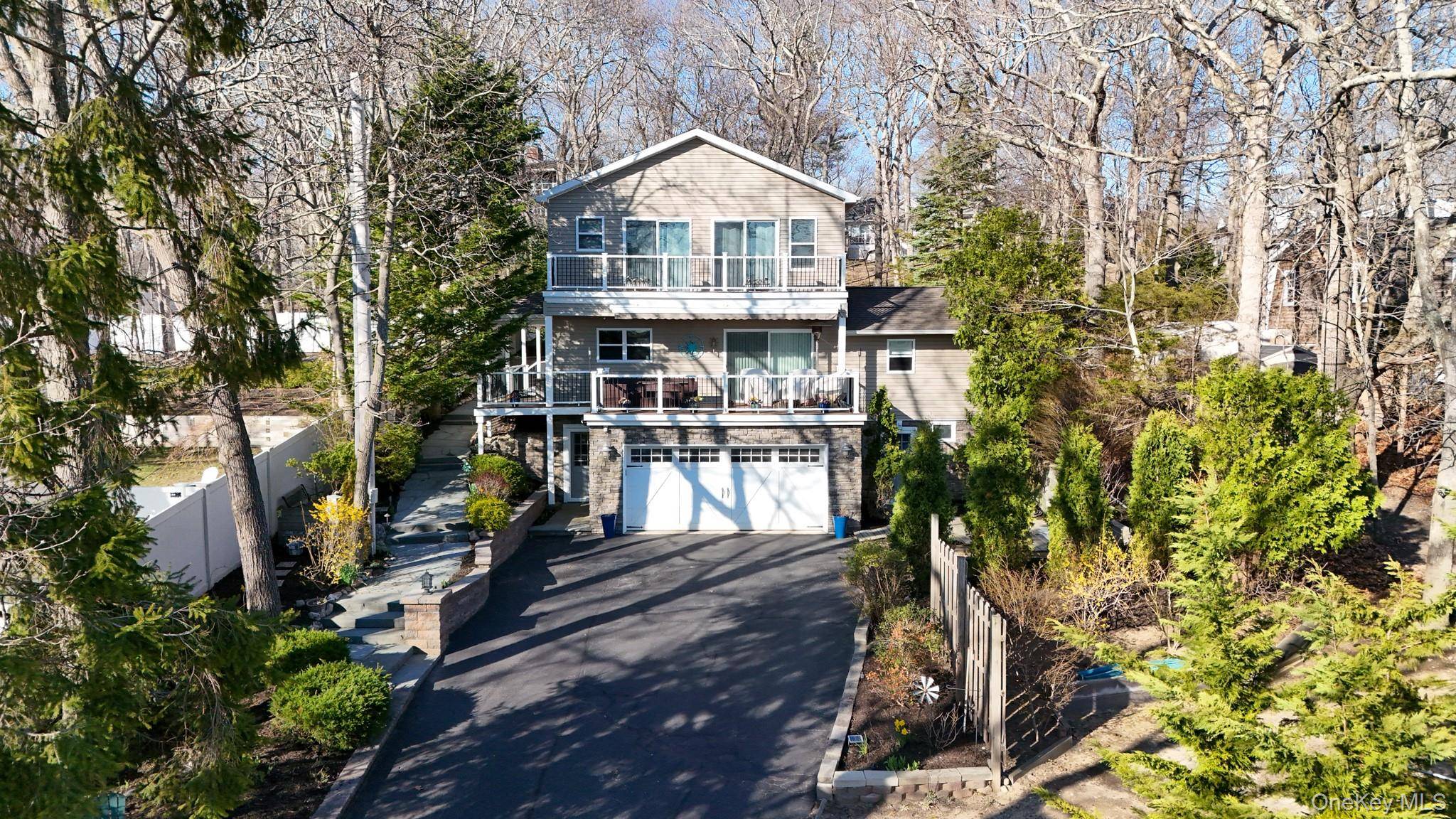 Meticulously maintained home with stunning water views in beautiful Fleet's Neck community !