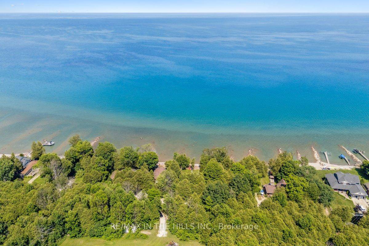 Nestled directly on the crystal clear shores of Georgian Bay and tucked among towering cedars, this extraordinary property offers a rare chance to own a double lot with an impressive ...