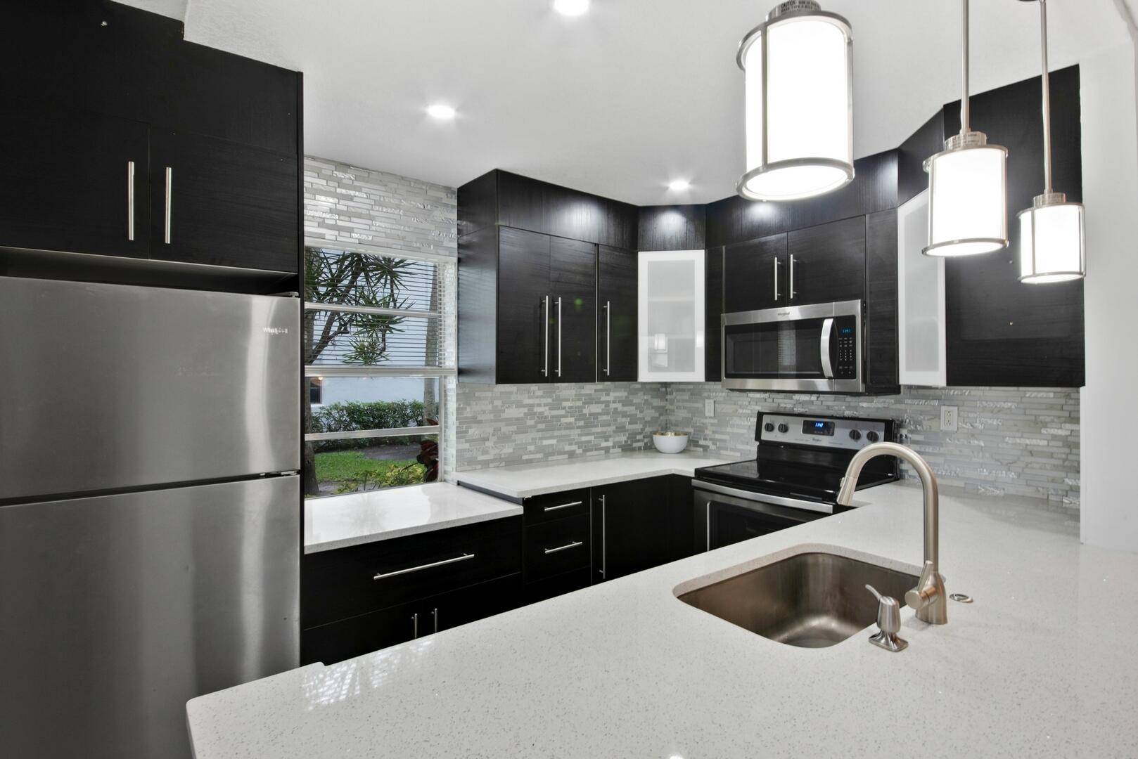 Step into this meticulously updated 2 bedroom, 2 bathroom condo where every detail has been thoughtfully curated for modern living.