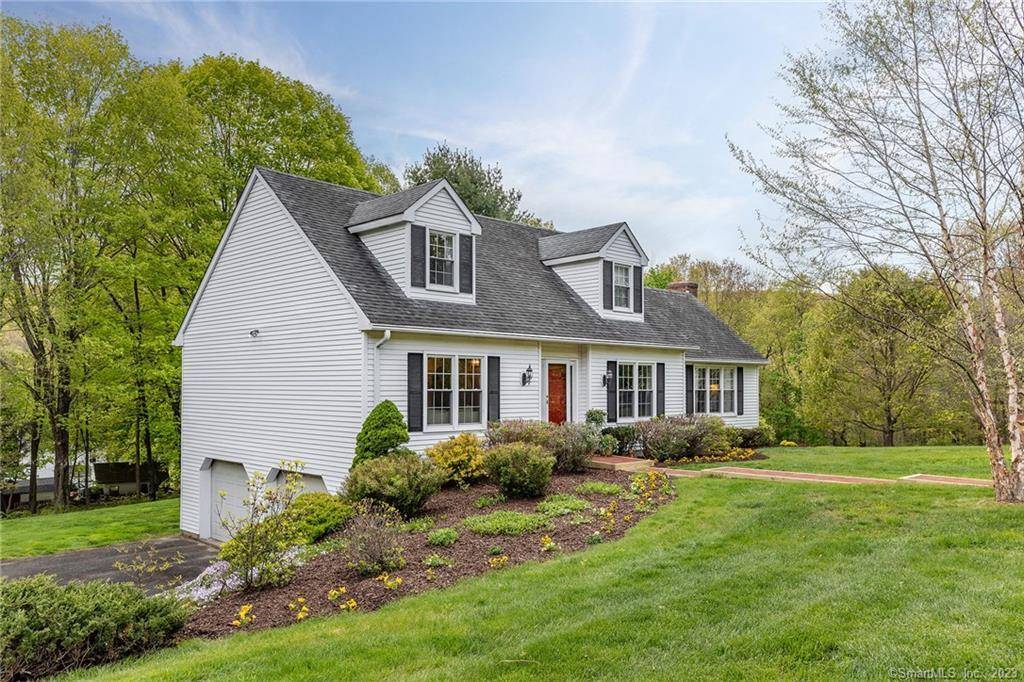A pristine Connecticut cape with professional landscaping set on just under 1 acre on a well maintained cul de sac.
